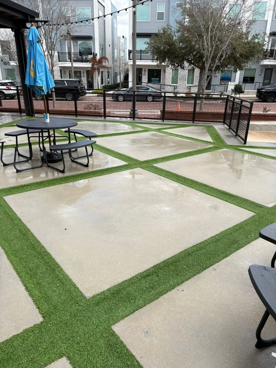 Freshly pressure washed paver and turf courtyard at the Oviedo on the Park Food Factory restaurant district