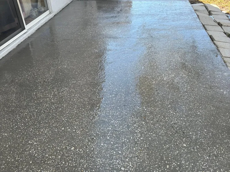 Same patio freshly washed with clean bright concrete