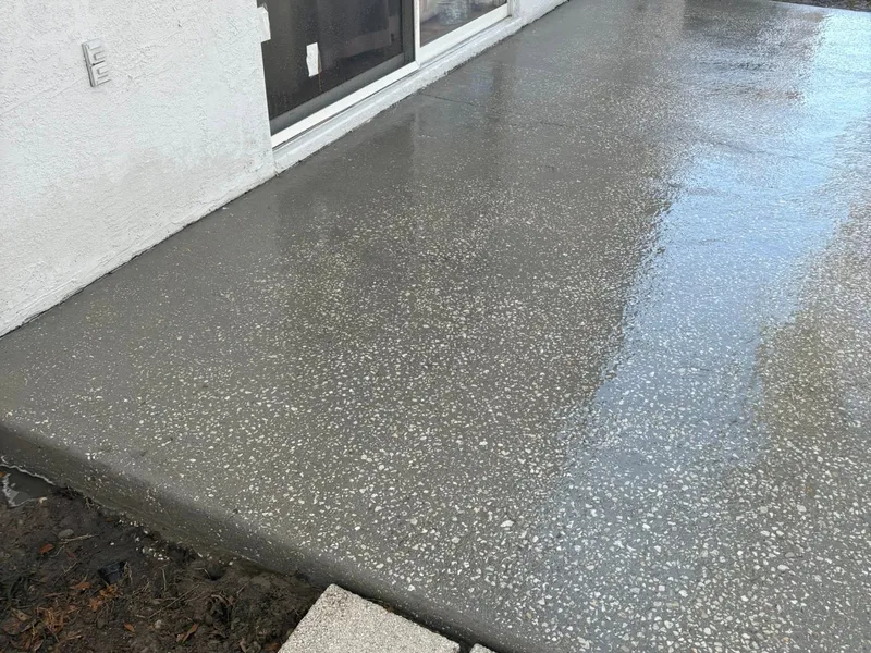 Spotless wet patio along the sliding door after pressure washing